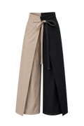 Two-tone pants with beige and navy blue sections on transparent background