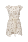 White crochet dress on a gray background