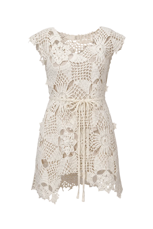 White crochet dress on a gray background