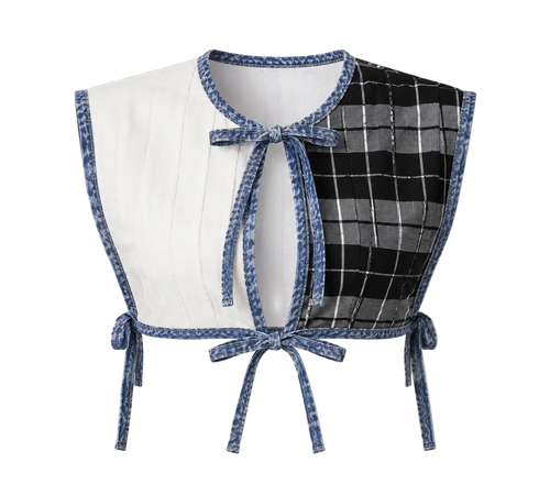 Two-piece outfit with a white top and plaid skirt on a gray background